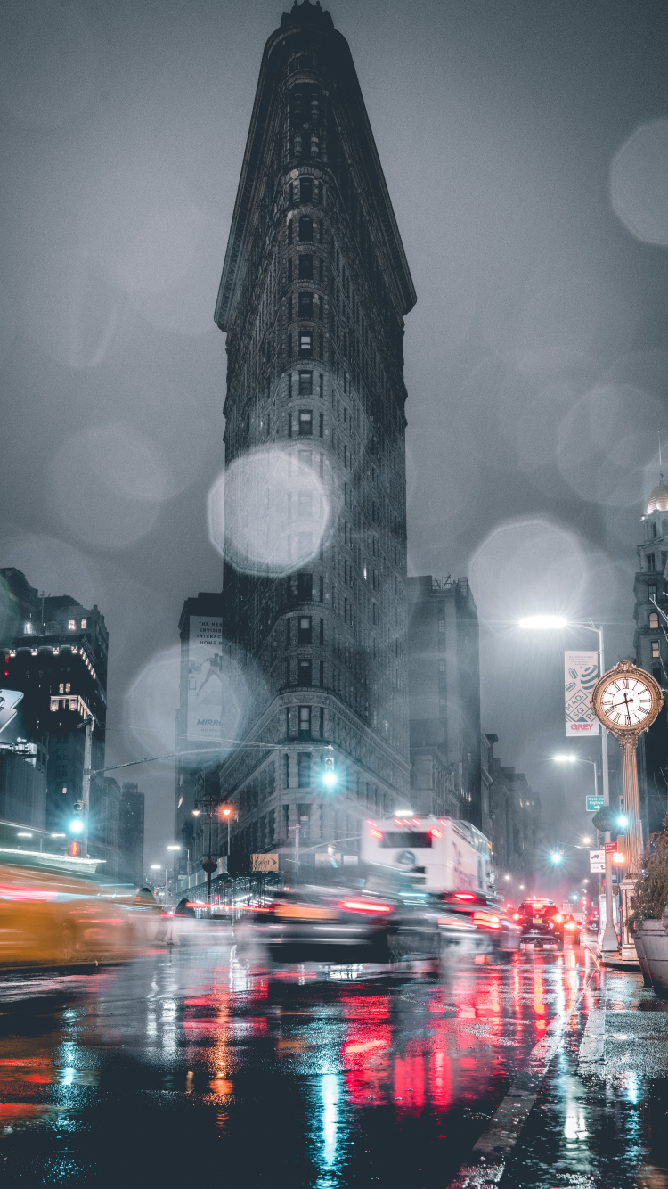 Cars on Road Near High Rise Buildings During Night Time. Wallpaper in 750x1334 Resolution