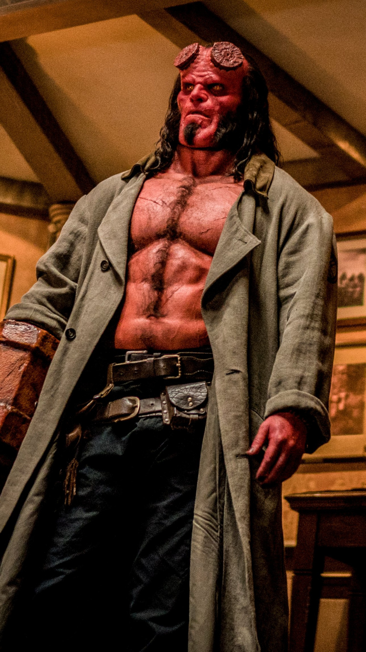 Man in Brown Coat Standing Near Brown Wooden Chair. Wallpaper in 750x1334 Resolution