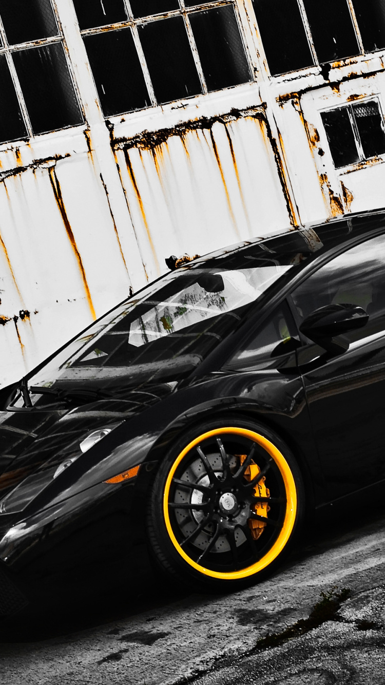 Black Coupe Parked Beside White Wall. Wallpaper in 750x1334 Resolution