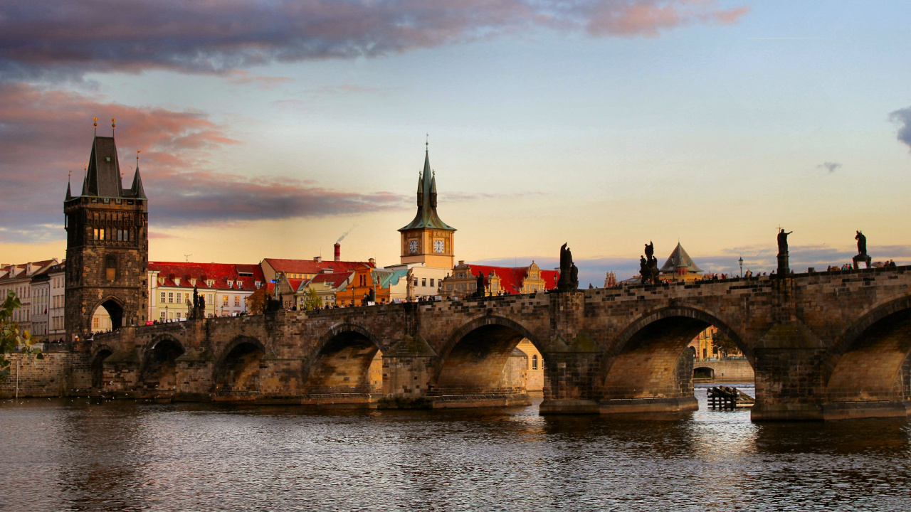Brown Concrete Bridge Over River During Sunset. Wallpaper in 1280x720 Resolution