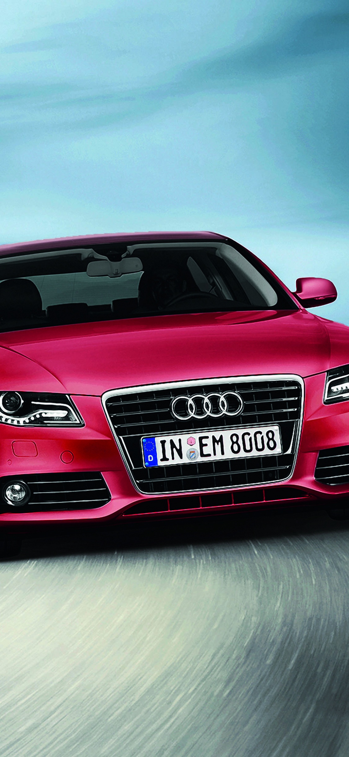 Audi Rouge a 4 Sur Route. Wallpaper in 1125x2436 Resolution