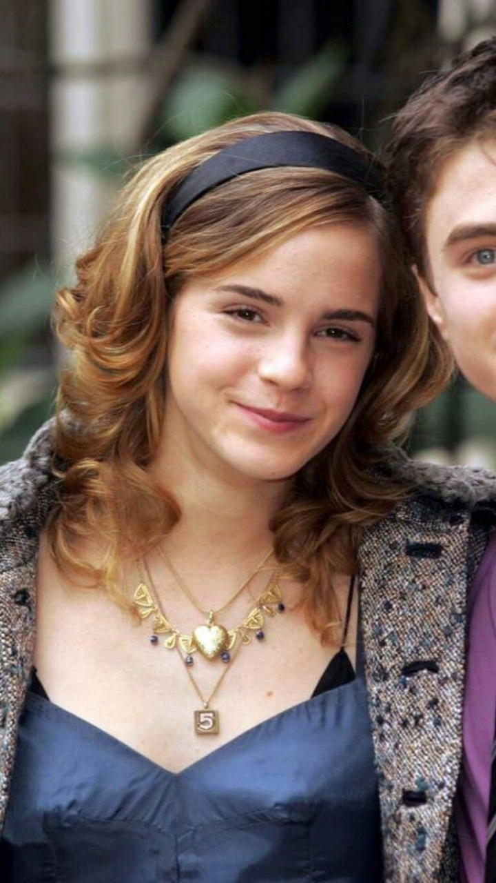 Woman in Blue Dress Beside Woman in Blue Dress. Wallpaper in 720x1280 Resolution