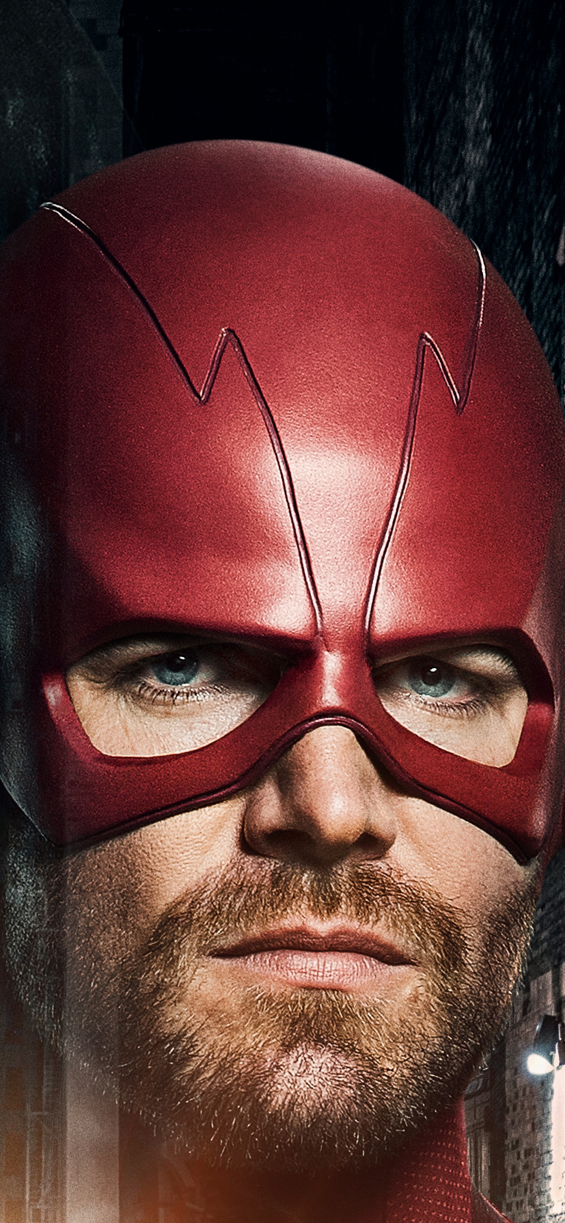 Man in Red Mask and Green Leaves. Wallpaper in 1125x2436 Resolution