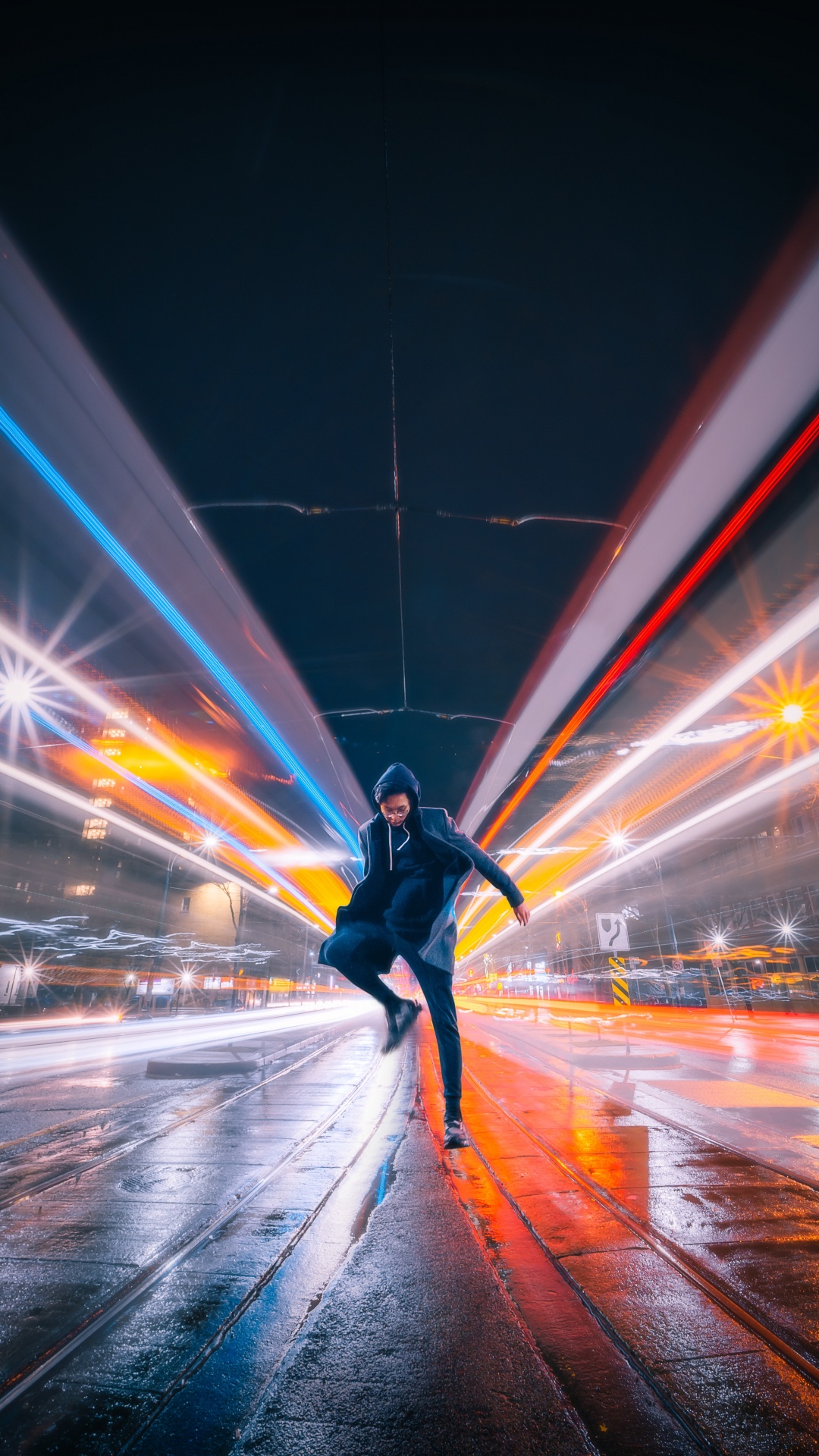 Man in Black Jacket and Black Pants Walking on Street During Night Time. Wallpaper in 1080x1920 Resolution