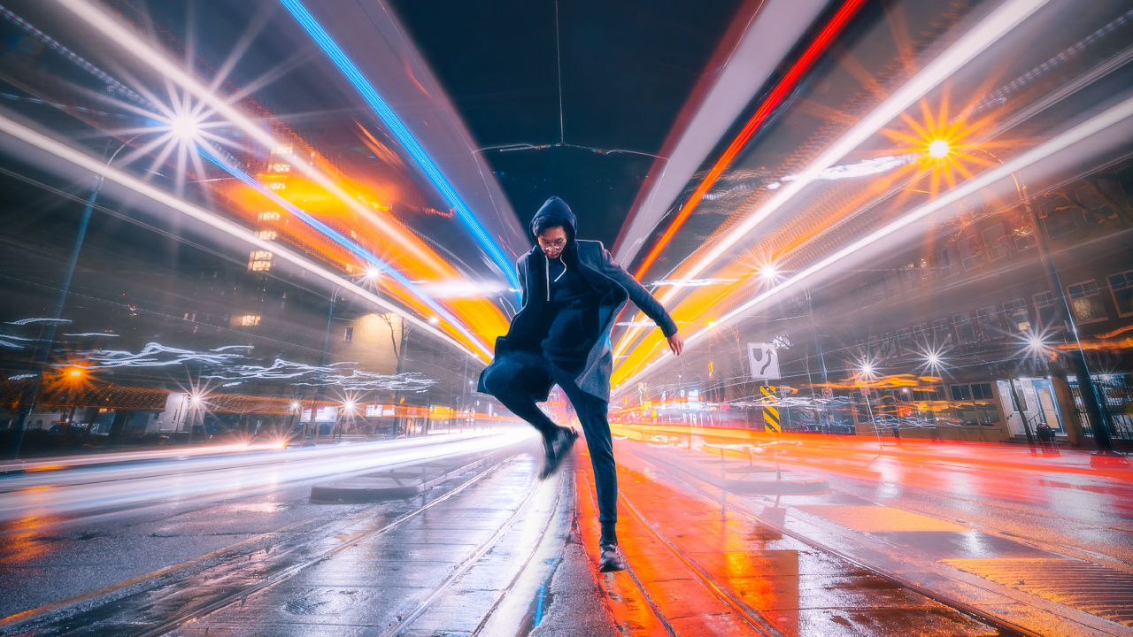 Man in Black Jacket and Black Pants Walking on Street During Night Time. Wallpaper in 1280x720 Resolution