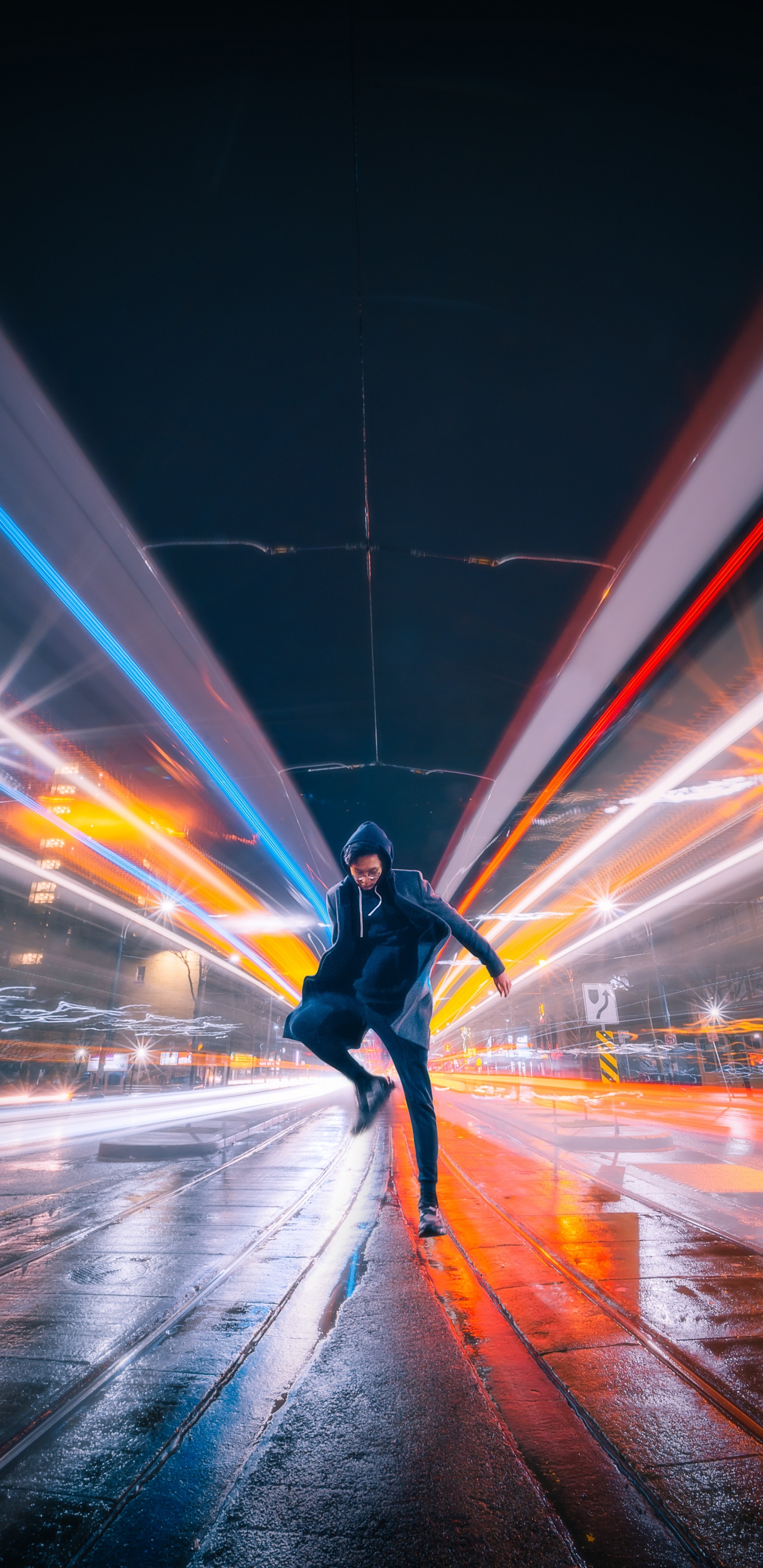 Man in Black Jacket and Black Pants Walking on Street During Night Time. Wallpaper in 1440x2960 Resolution