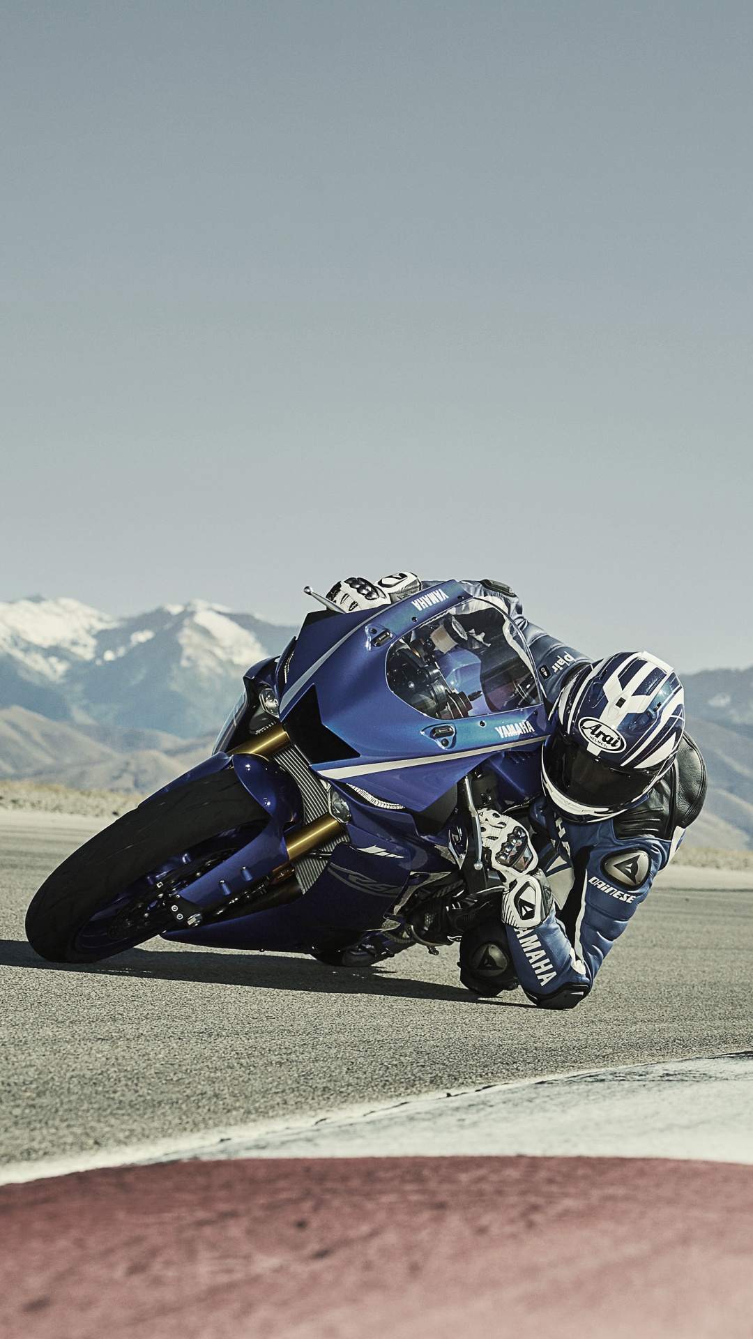 Man Riding Blue and White Sports Bike on Brown Field During Daytime. Wallpaper in 1080x1920 Resolution