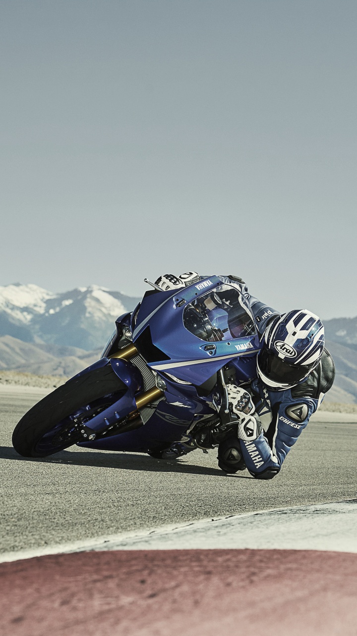 Man Riding Blue and White Sports Bike on Brown Field During Daytime. Wallpaper in 720x1280 Resolution