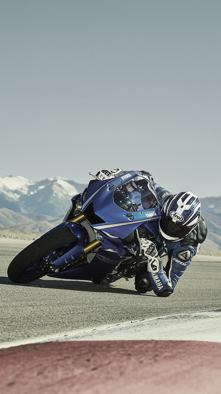 Man Riding Blue and White Sports Bike on Brown Field During Daytime. Wallpaper in 750x1334 Resolution