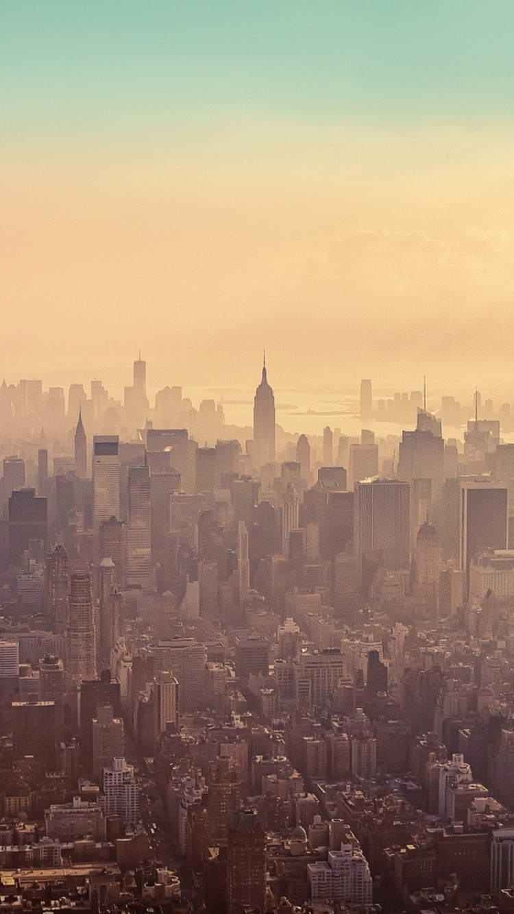 Aerial View of City Buildings During Sunset. Wallpaper in 750x1334 Resolution