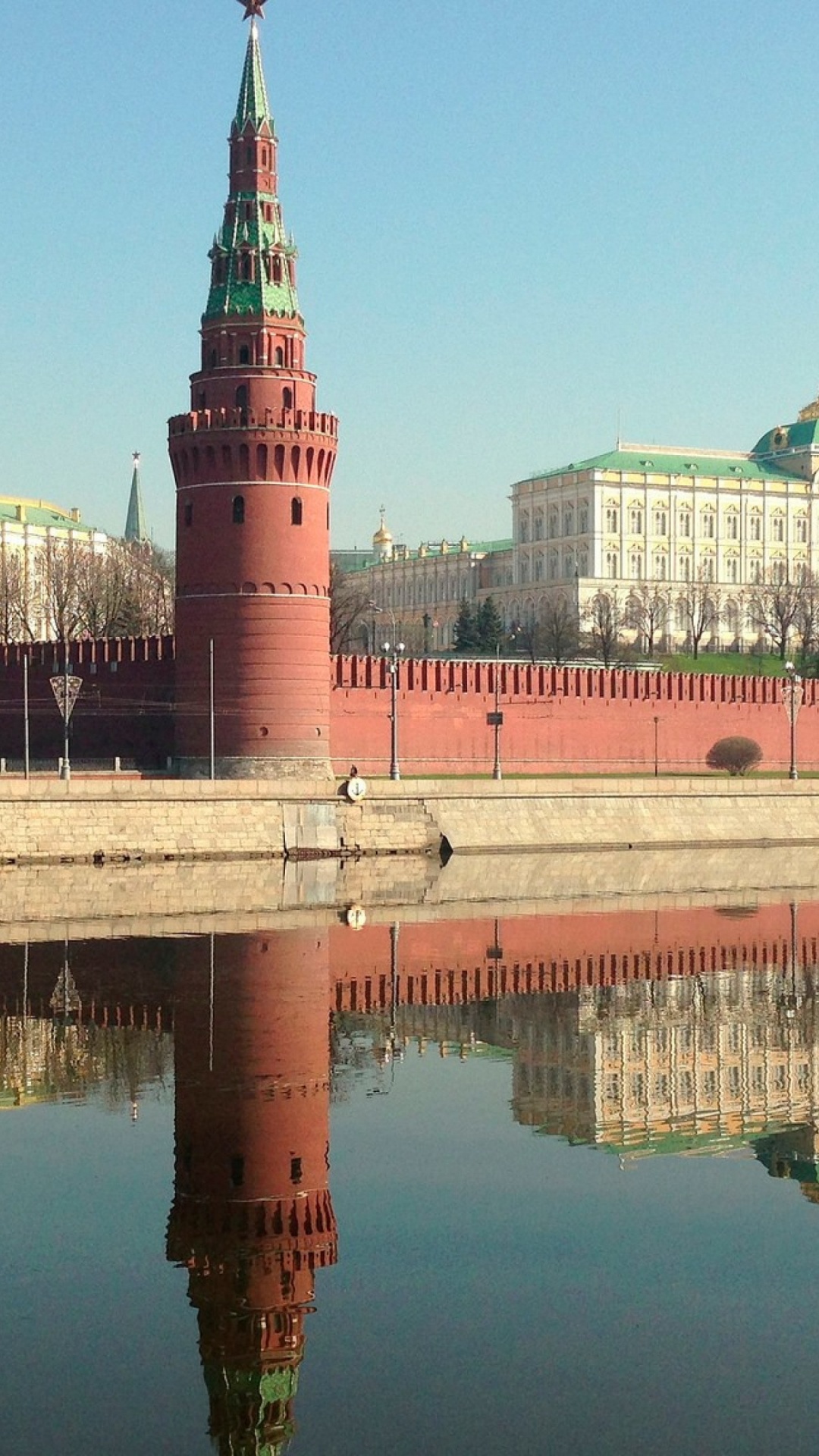 Green and White Concrete Building Near Body of Water During Daytime. Wallpaper in 1080x1920 Resolution