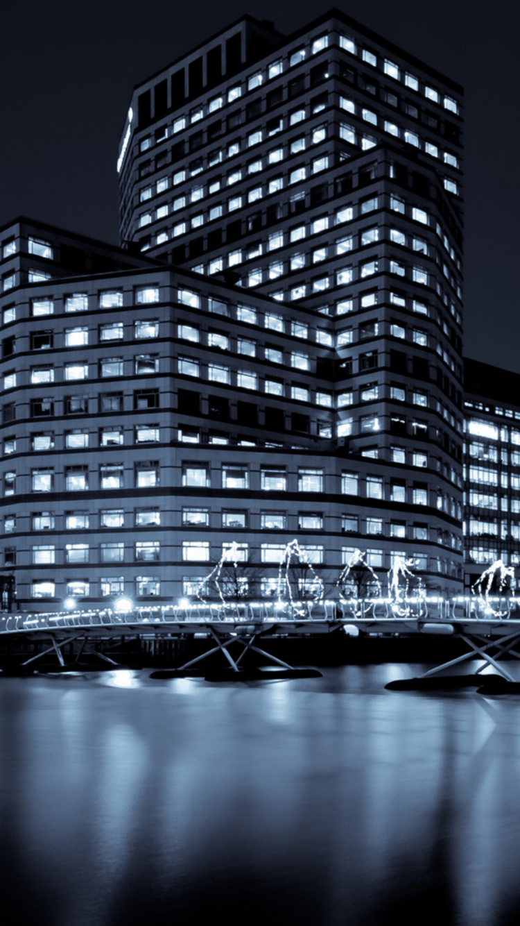 Lighted High Rise Building During Night Time. Wallpaper in 750x1334 Resolution