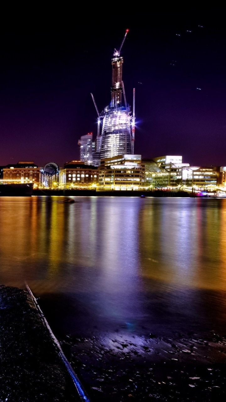 Body of Water Near City Buildings During Night Time. Wallpaper in 720x1280 Resolution