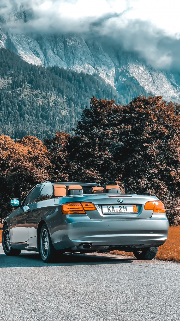 Silver Sedan on Gray Asphalt Road During Daytime. Wallpaper in 750x1334 Resolution