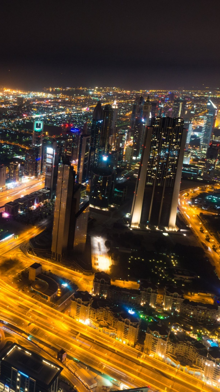 City With High Rise Buildings During Night Time. Wallpaper in 720x1280 Resolution