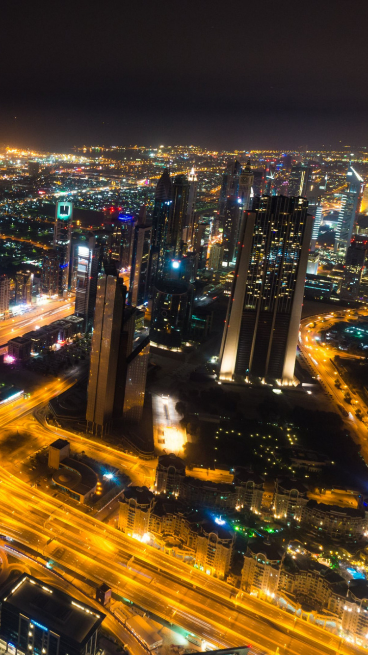 City With High Rise Buildings During Night Time. Wallpaper in 750x1334 Resolution