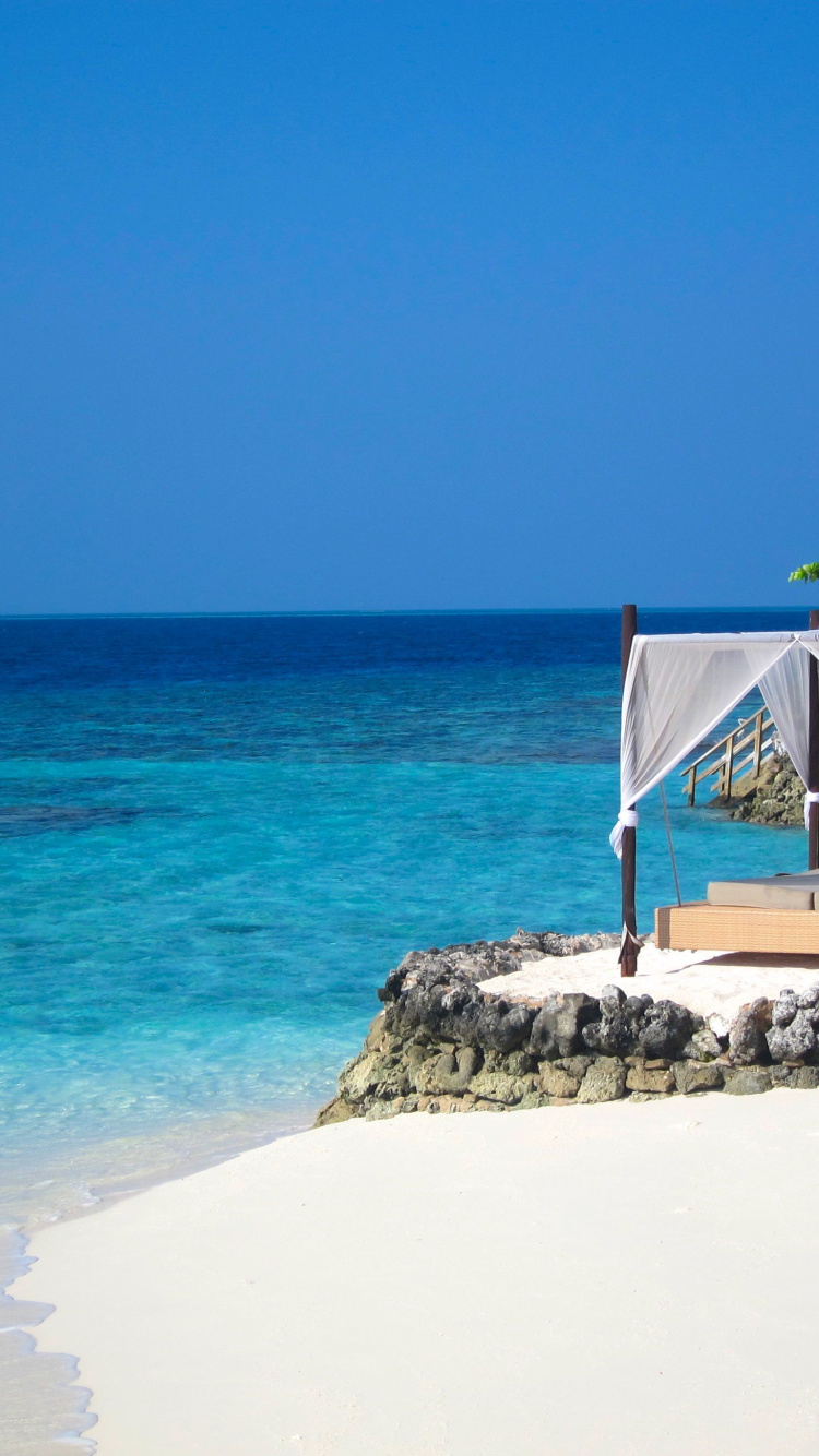 White and Gray Gazebo on Gray Rocky Shore During Daytime. Wallpaper in 750x1334 Resolution
