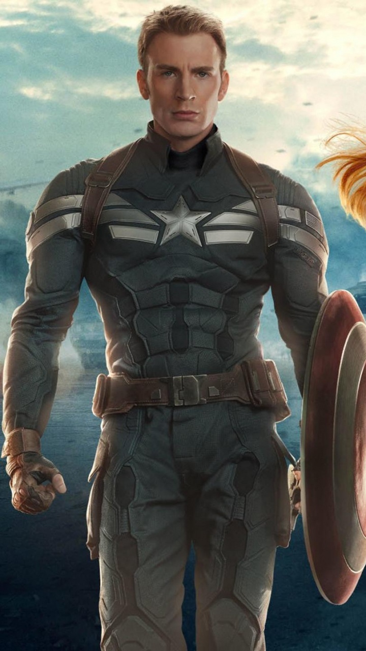 Mann Und Frau im Schwarzen Und Braunen Anzug Stehen am Strandufer. Wallpaper in 720x1280 Resolution