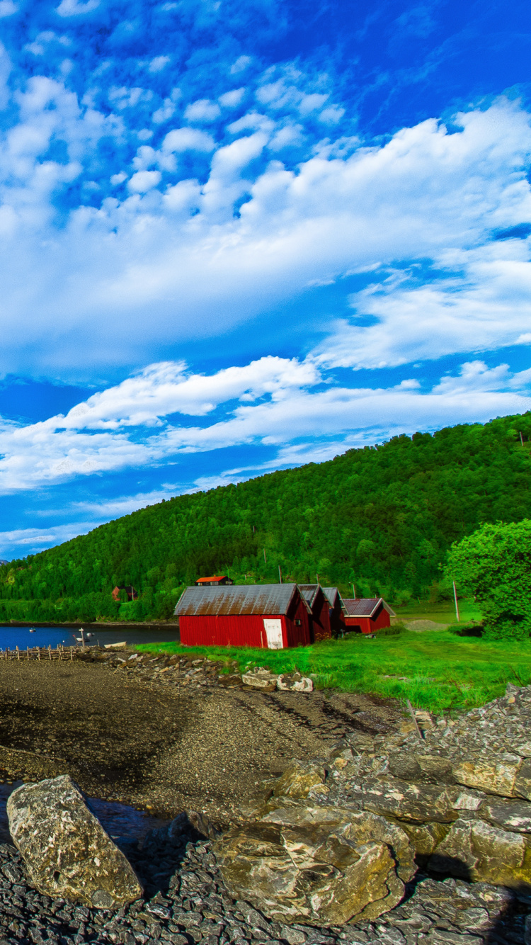 Red and White House Near Lake Under Blue Sky During Daytime. Wallpaper in 750x1334 Resolution