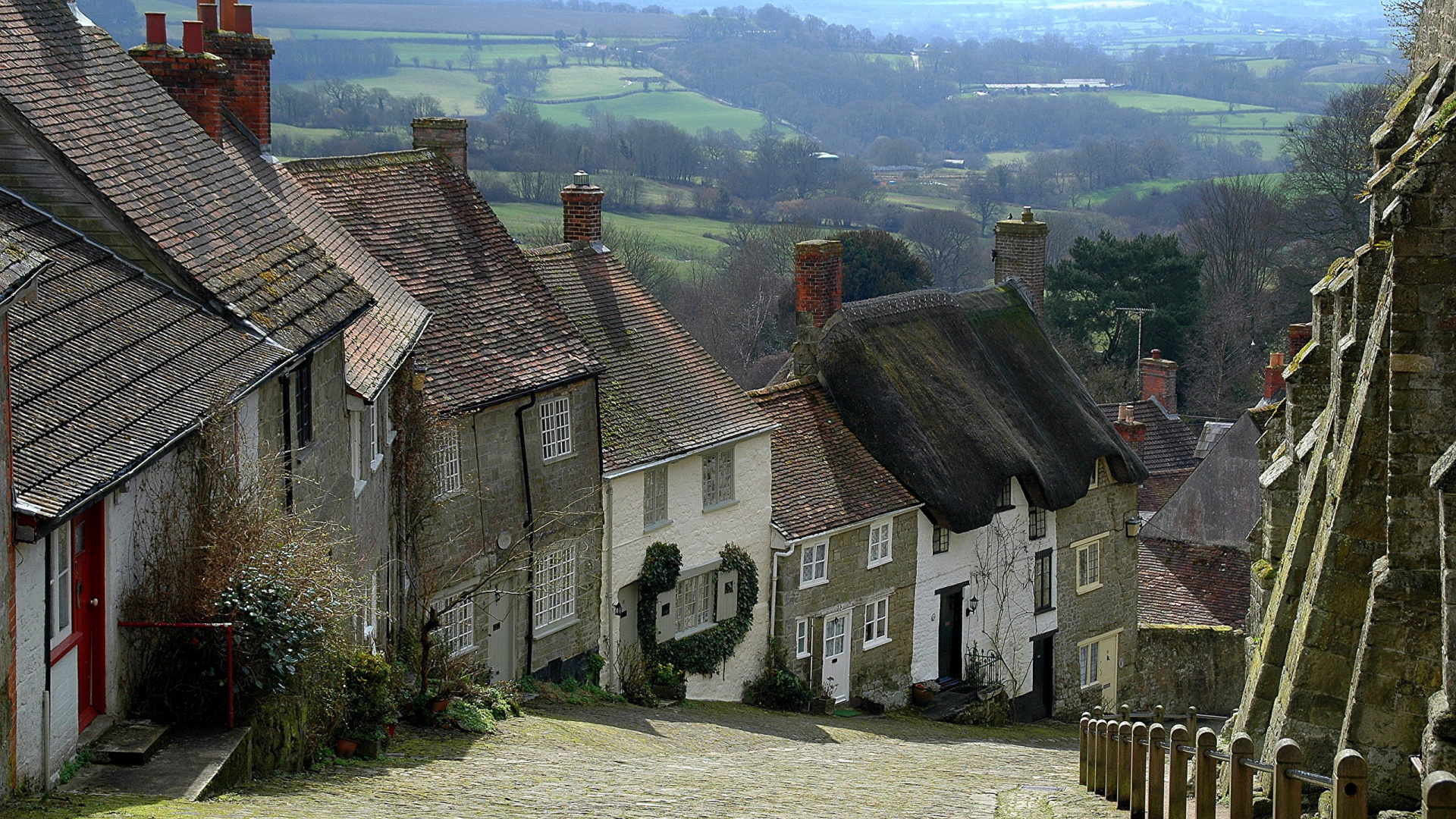 Gray Concrete Houses Near Green Grass Field During Daytime. Wallpaper in 1920x1080 Resolution
