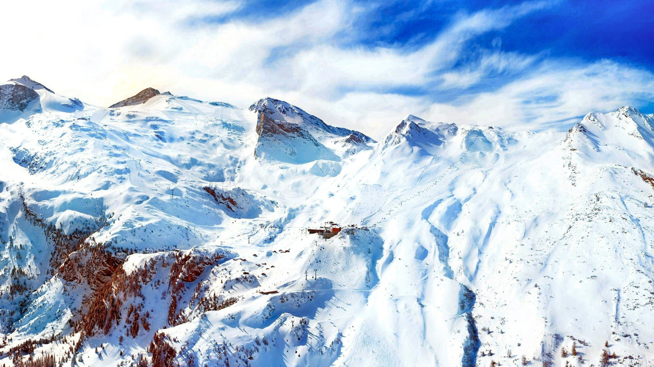 Snow Covered Mountain Under Cloudy Sky During Daytime. Wallpaper in 1280x720 Resolution