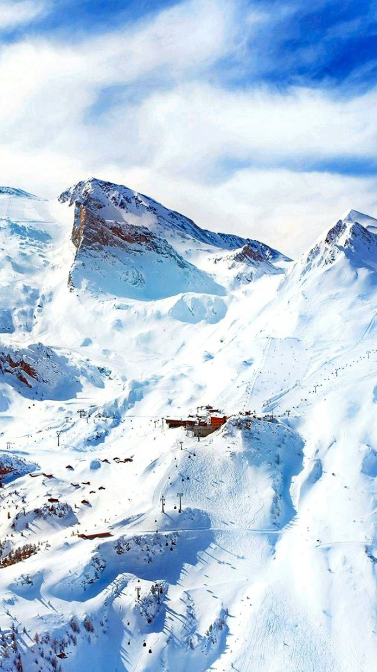 Snow Covered Mountain Under Cloudy Sky During Daytime. Wallpaper in 750x1334 Resolution