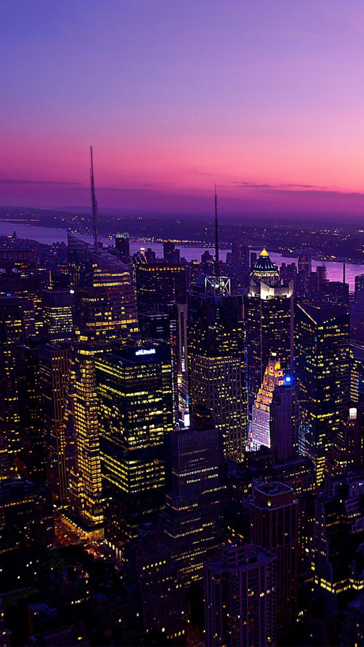 Aerial View of City Buildings During Night Time. Wallpaper in 750x1334 Resolution