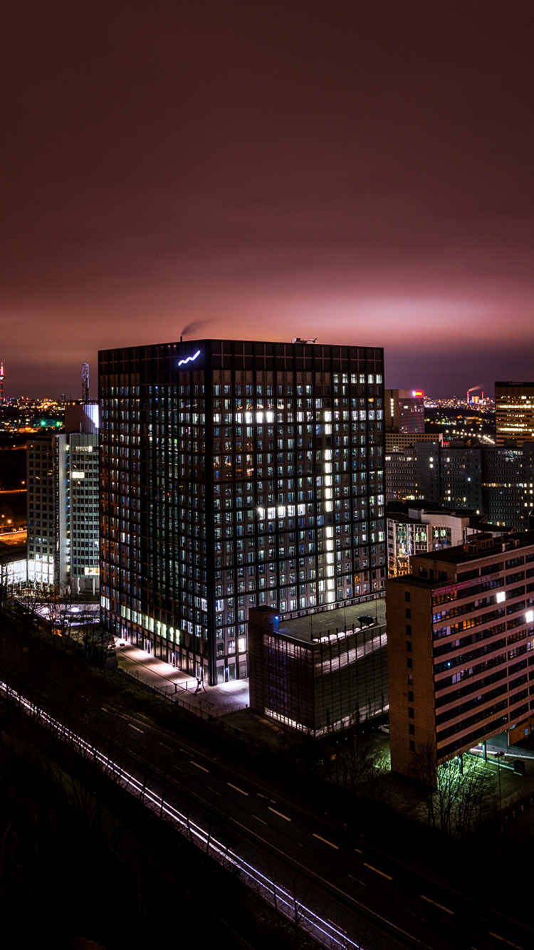 City With High Rise Buildings During Night Time. Wallpaper in 750x1334 Resolution