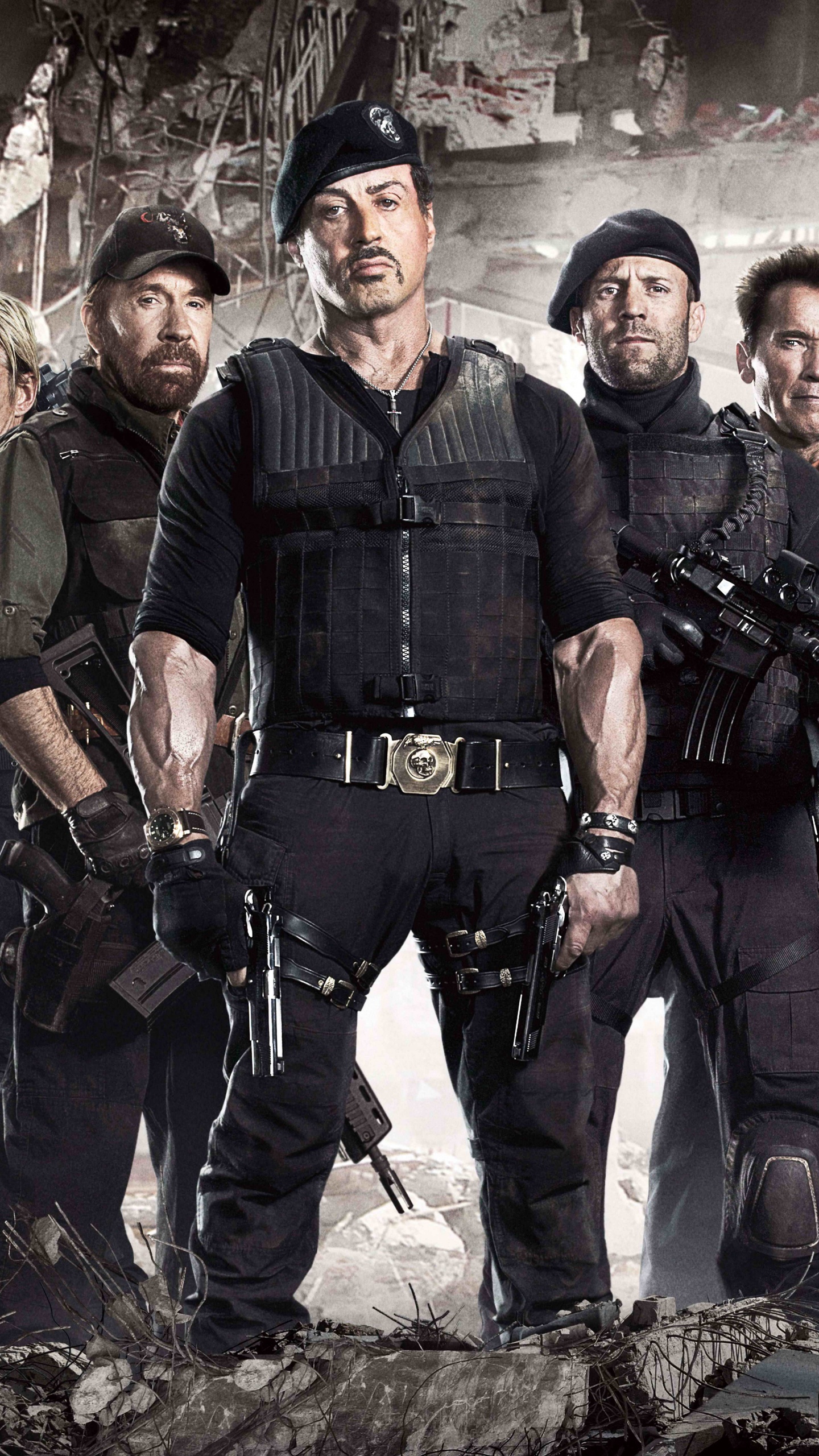 Group of Men in Black Uniform Standing on Rocky Ground. Wallpaper in 1440x2560 Resolution