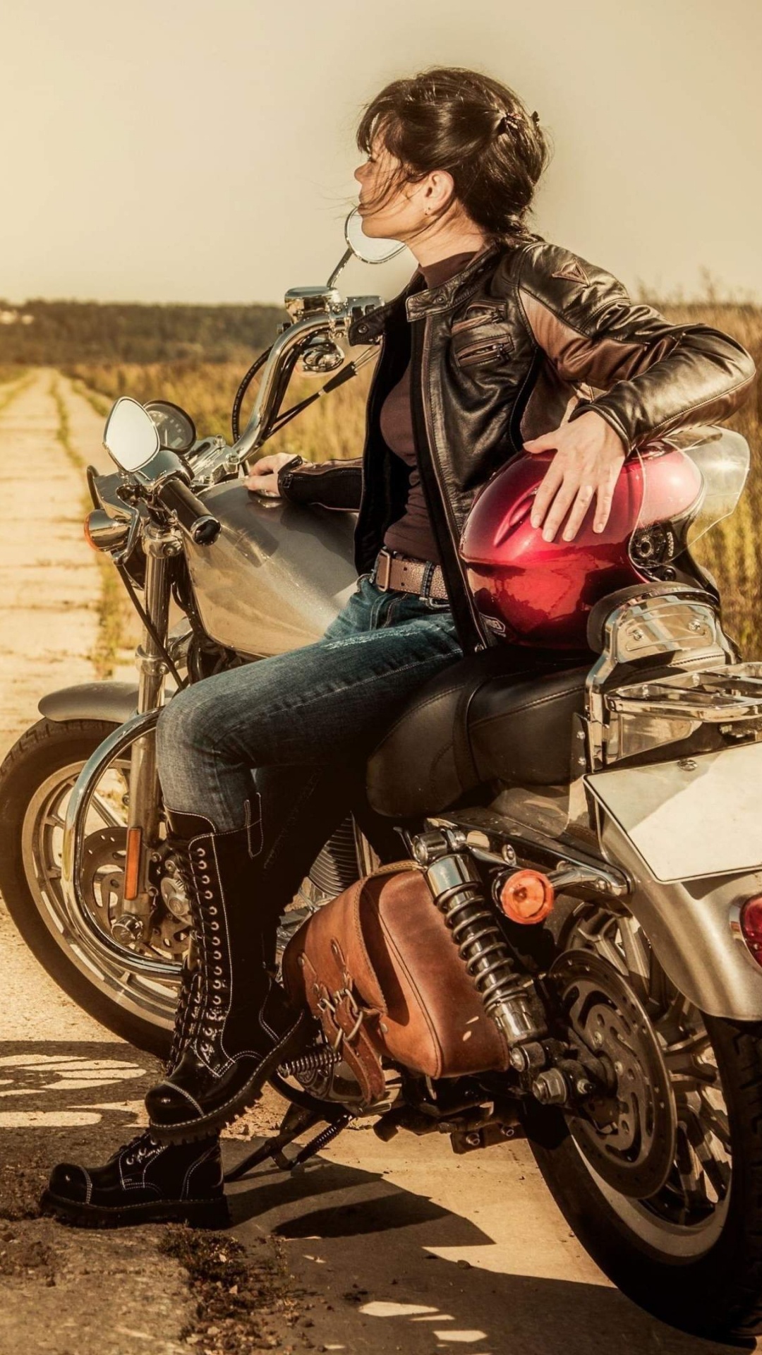 Woman in Black Jacket and Blue Denim Jeans Sitting on Black Motorcycle on Road During Daytime. Wallpaper in 1080x1920 Resolution
