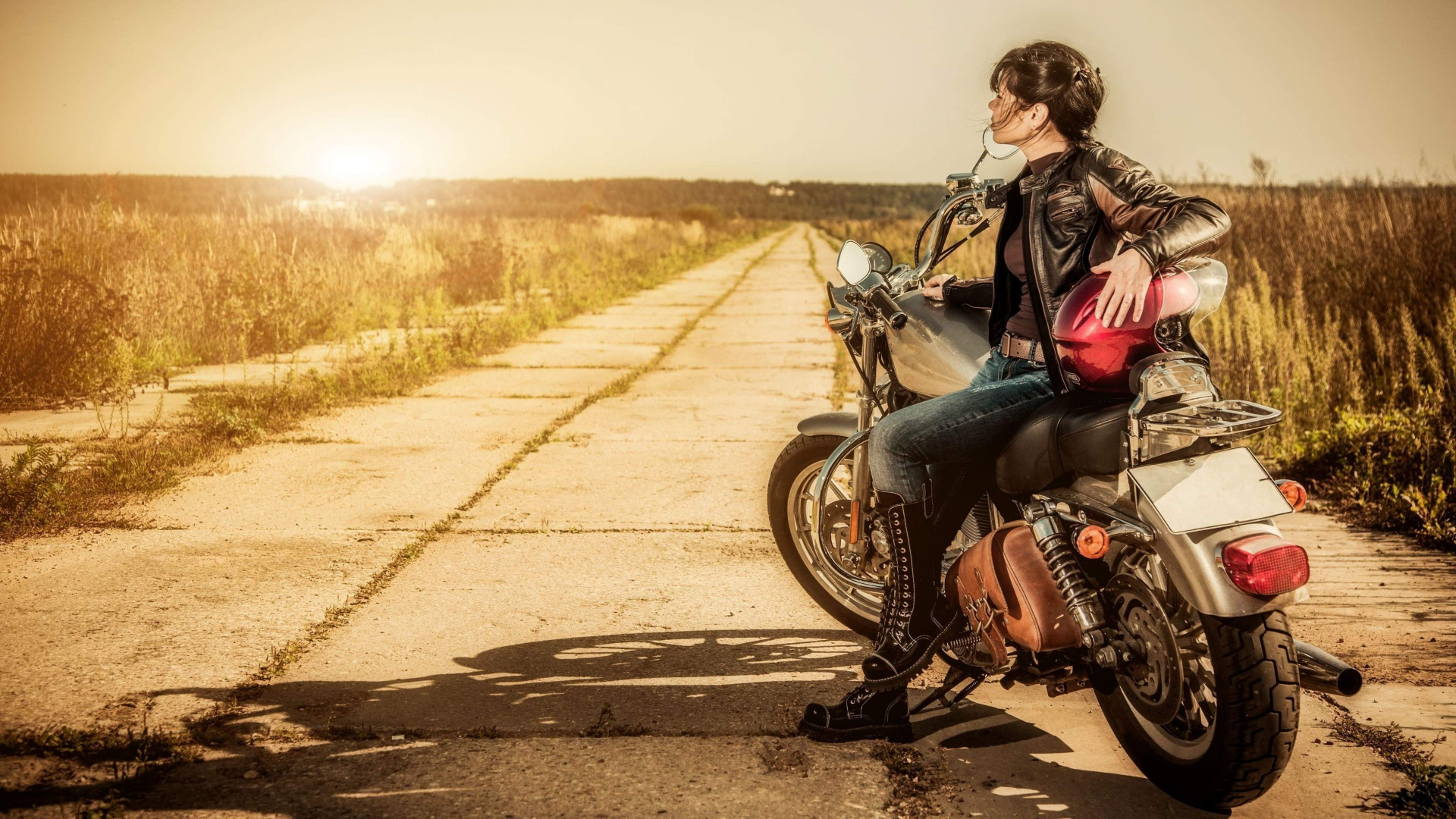 Woman in Black Jacket and Blue Denim Jeans Sitting on Black Motorcycle on Road During Daytime. Wallpaper in 1920x1080 Resolution