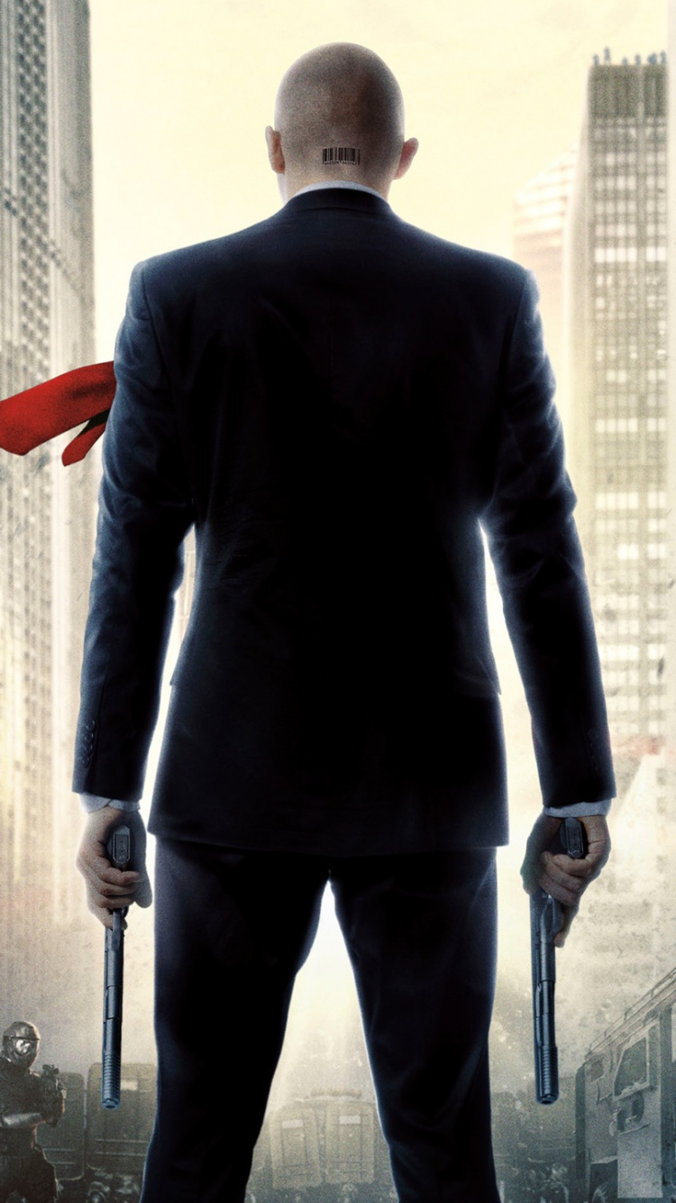 Man in Black Suit Standing on Gray Concrete Floor. Wallpaper in 750x1334 Resolution
