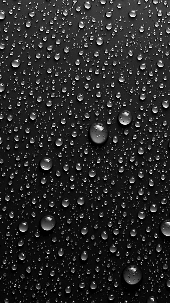 Water Droplets on Black Surface. Wallpaper in 720x1280 Resolution
