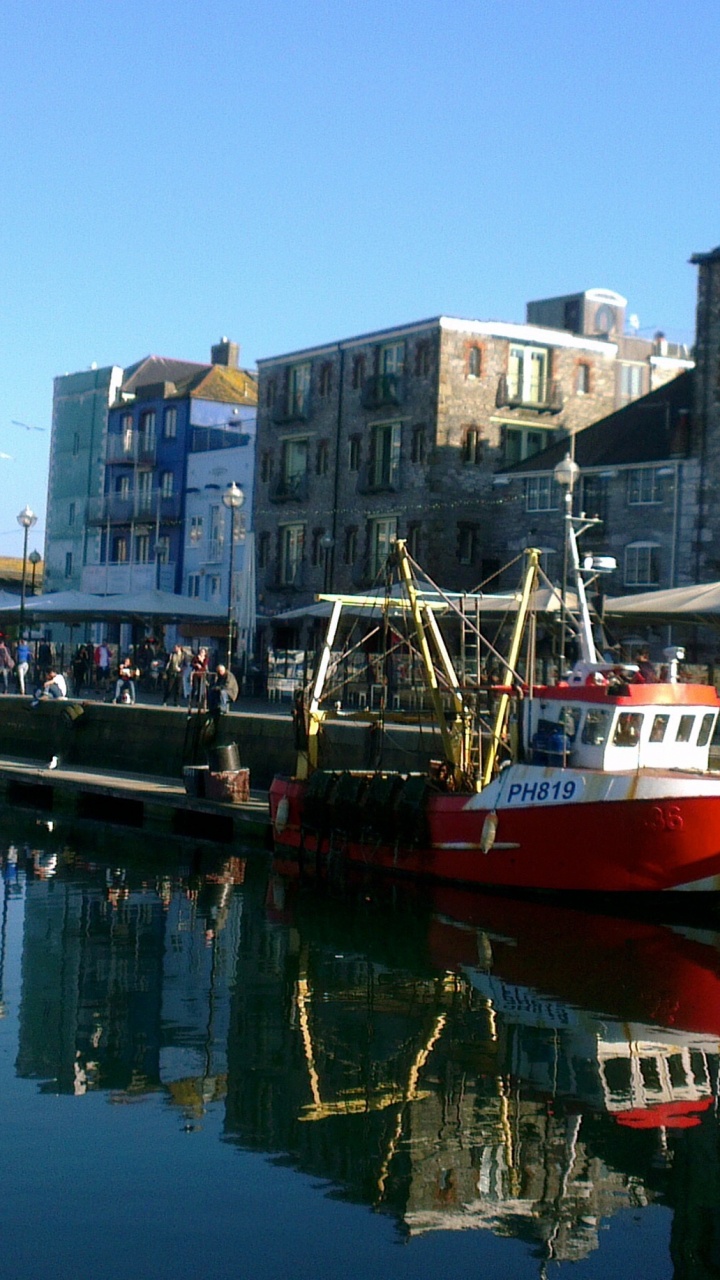 Red and White Boat on Water Near Buildings During Daytime. Wallpaper in 720x1280 Resolution