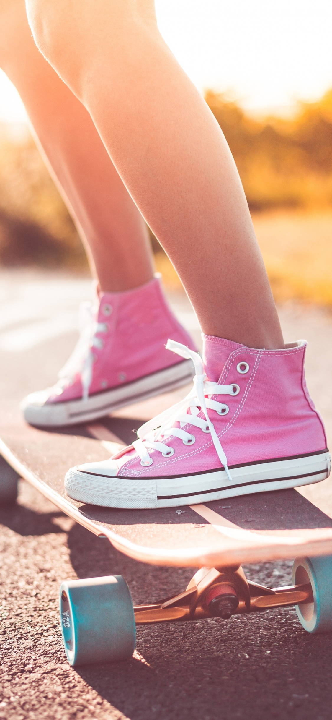 Person in Pink and White Nike Sneakers and Pink Nike Sneakers. Wallpaper in 1125x2436 Resolution