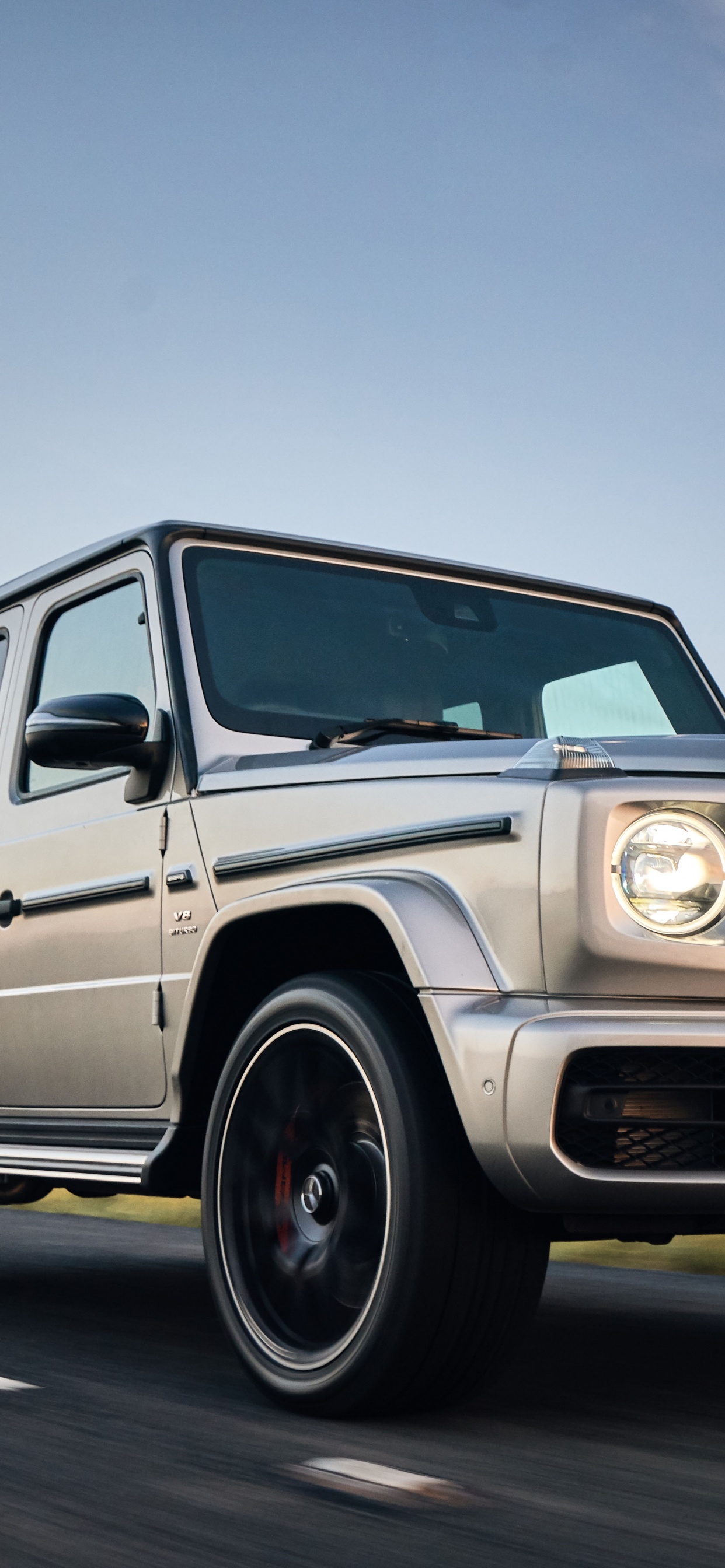 White Mercedes Benz g Class on Road During Daytime. Wallpaper in 1242x2688 Resolution