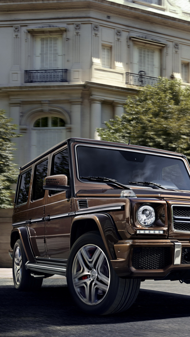 Black Car on Road Near Building During Daytime. Wallpaper in 750x1334 Resolution