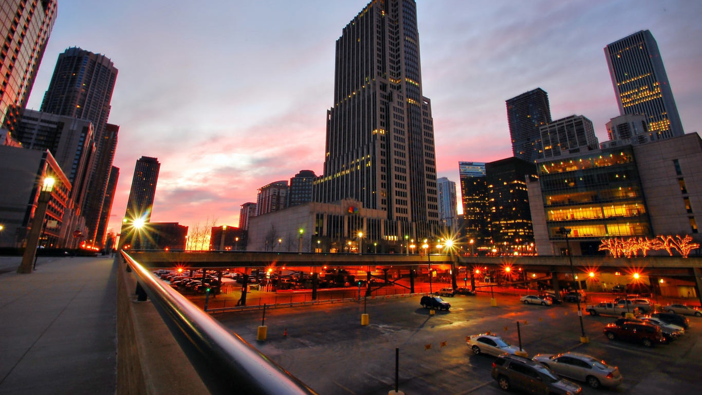 City Buildings Under Gray Sky During Night Time. Wallpaper in 1366x768 Resolution