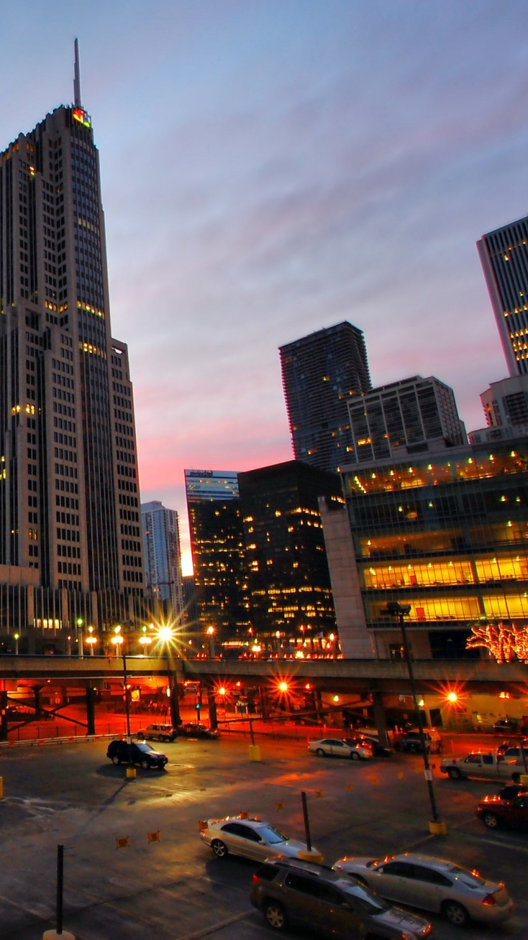 City Buildings Under Gray Sky During Night Time. Wallpaper in 750x1334 Resolution