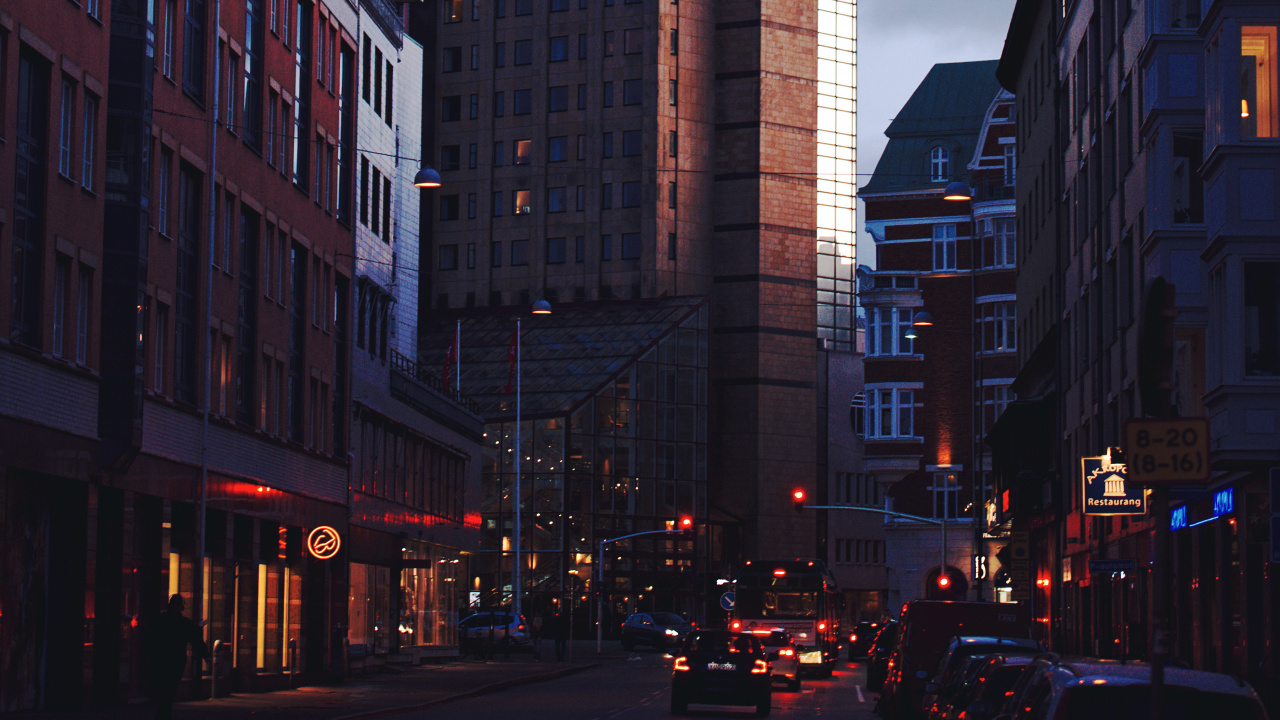 Cars on Road Between High Rise Buildings During Daytime. Wallpaper in 1280x720 Resolution