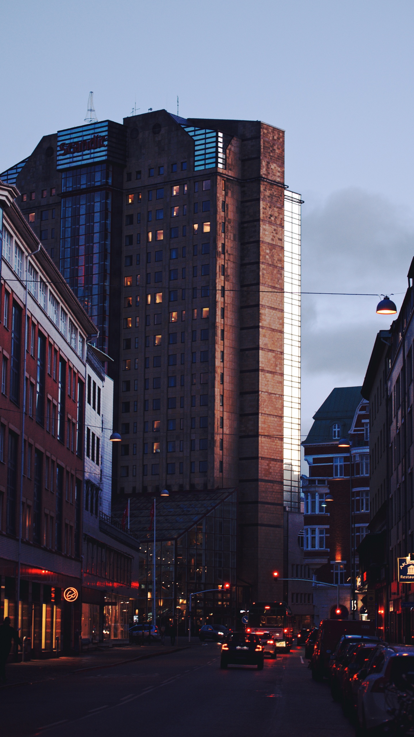 Cars on Road Between High Rise Buildings During Daytime. Wallpaper in 1440x2560 Resolution