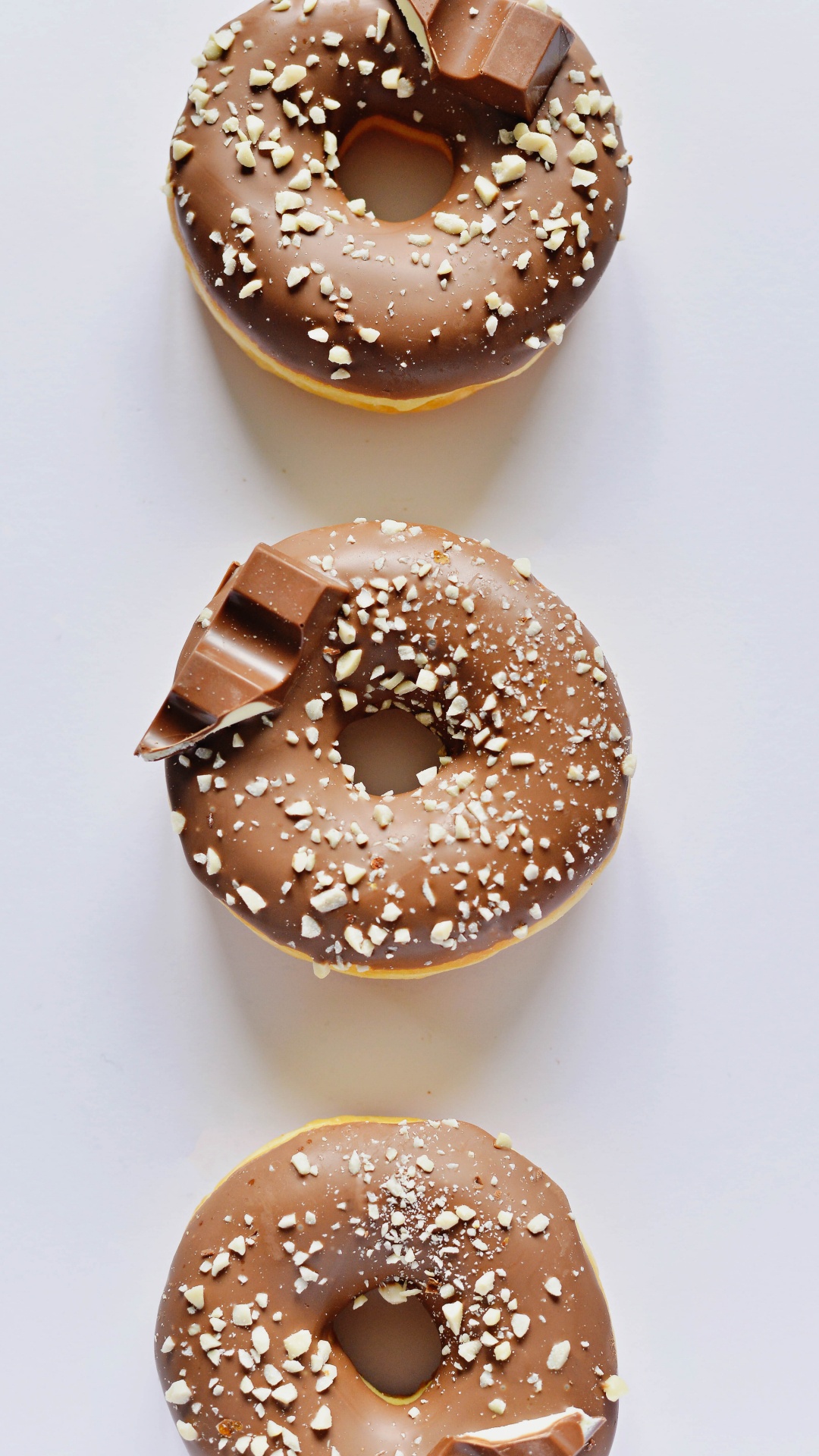 Brown Donut on White Table. Wallpaper in 1080x1920 Resolution