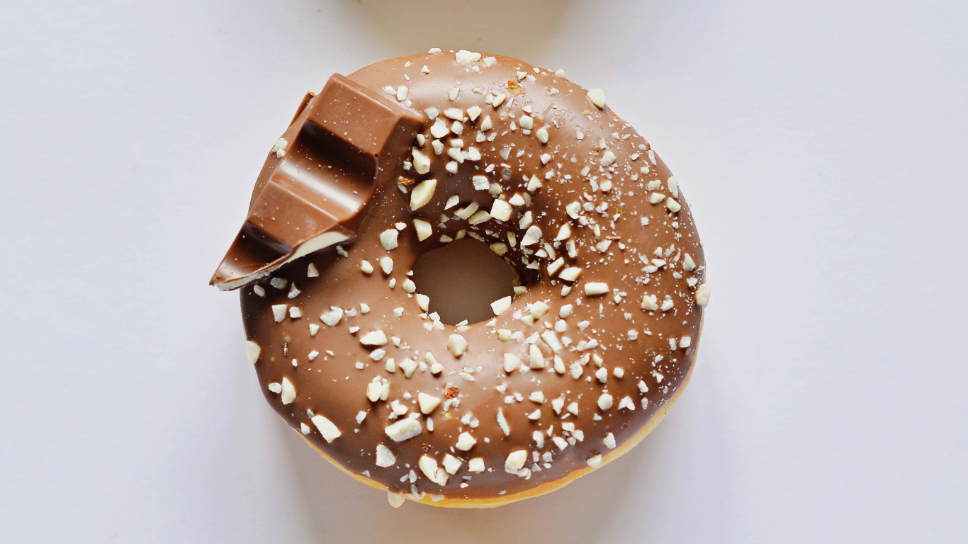Brown Donut on White Table. Wallpaper in 1366x768 Resolution