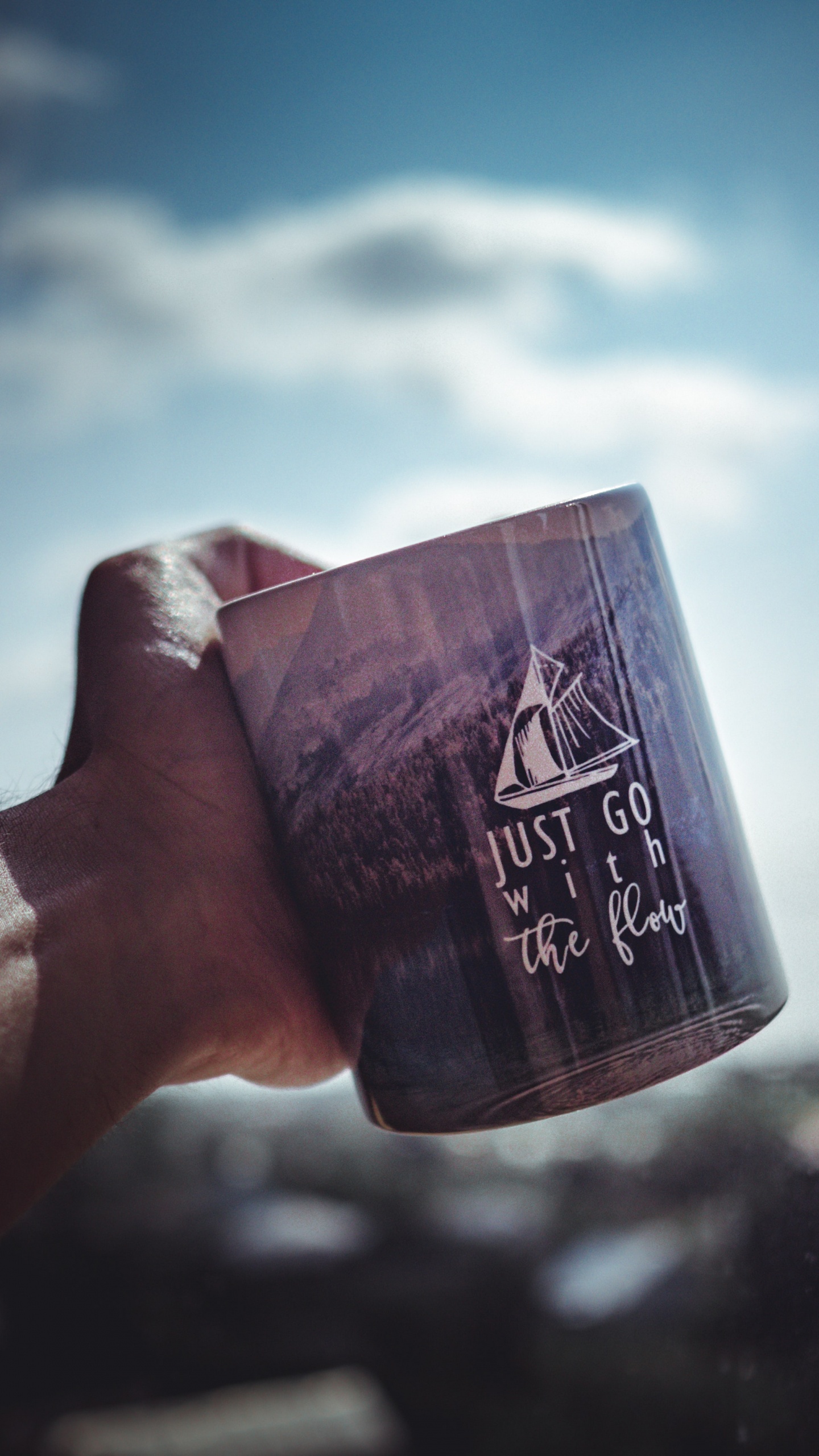 Person Holding Black and White Ceramic Mug. Wallpaper in 1440x2560 Resolution