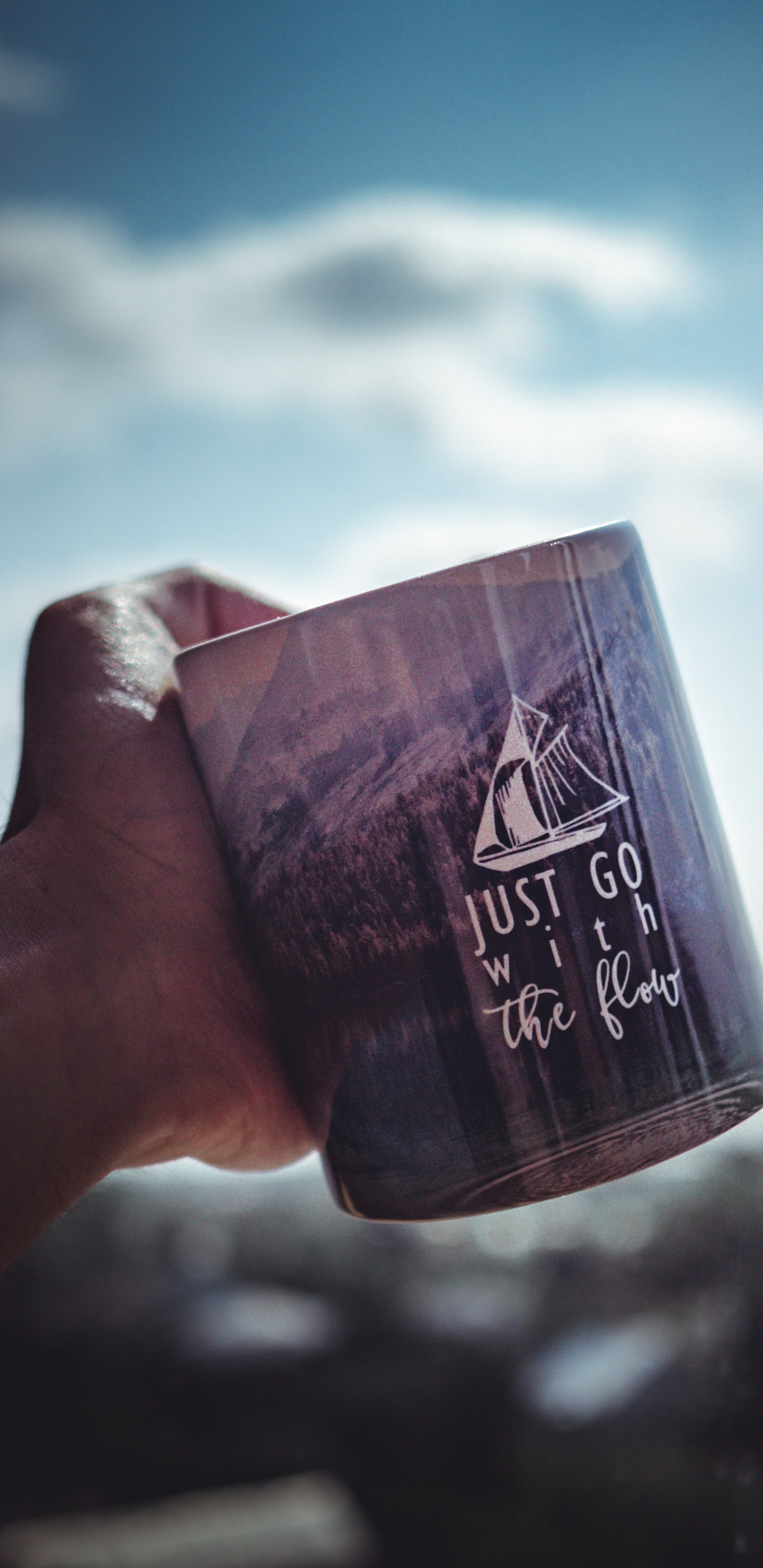 Person Holding Black and White Ceramic Mug. Wallpaper in 1440x2960 Resolution