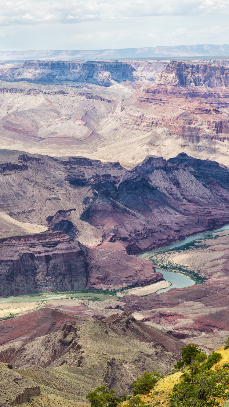 Aerial View of Lake in The Middle of Mountains. Wallpaper in 750x1334 Resolution
