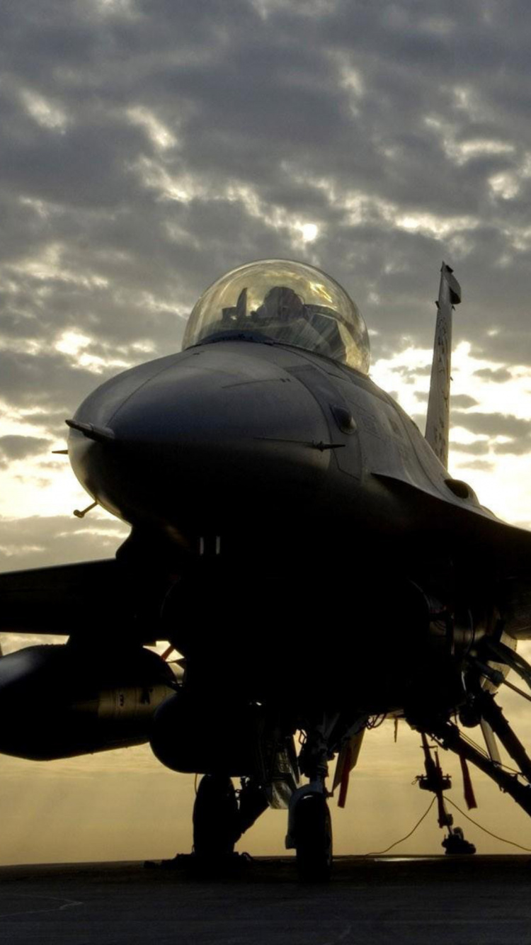 Black Fighter Plane Under White Clouds During Daytime. Wallpaper in 750x1334 Resolution