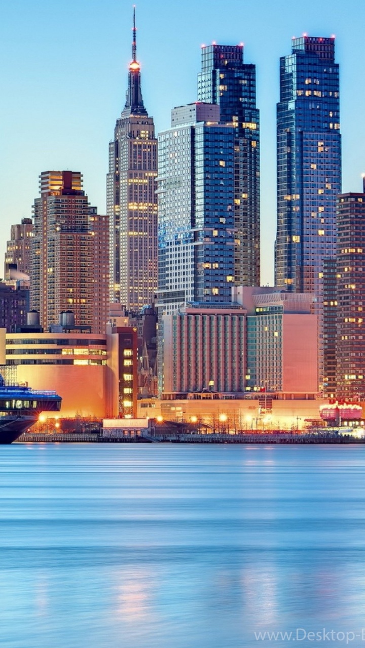 City Skyline Across Body of Water During Daytime. Wallpaper in 720x1280 Resolution