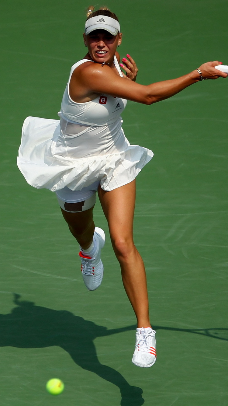 Woman in White Dress Holding Tennis Racket. Wallpaper in 750x1334 Resolution