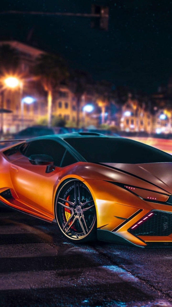 Blau-schwarzer Lamborghini Aventador Unterwegs Während Der Nacht. Wallpaper in 720x1280 Resolution